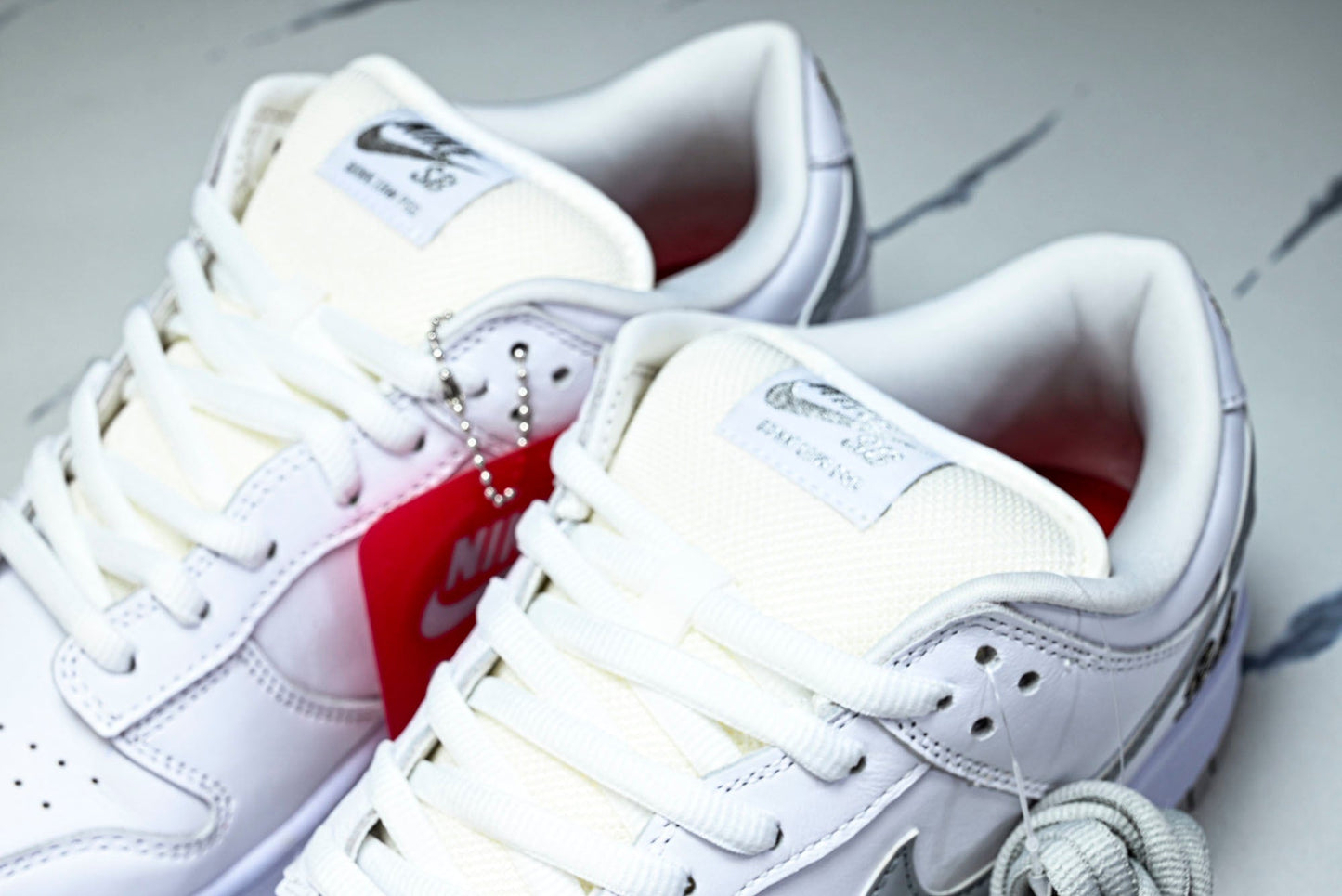 SB Dnk Low x Supreme 94 White Metallic Silver