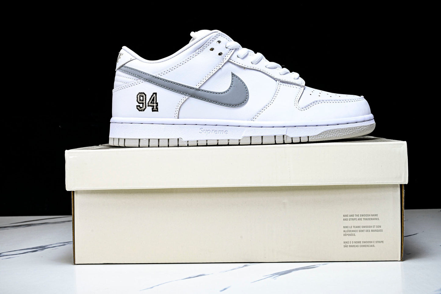 SB Dnk Low x Supreme 94 White Metallic Silver