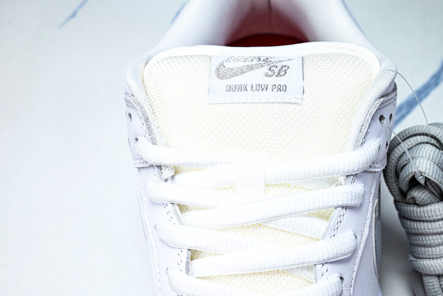 SB Dnk Low x Supreme 94 White Metallic Silver