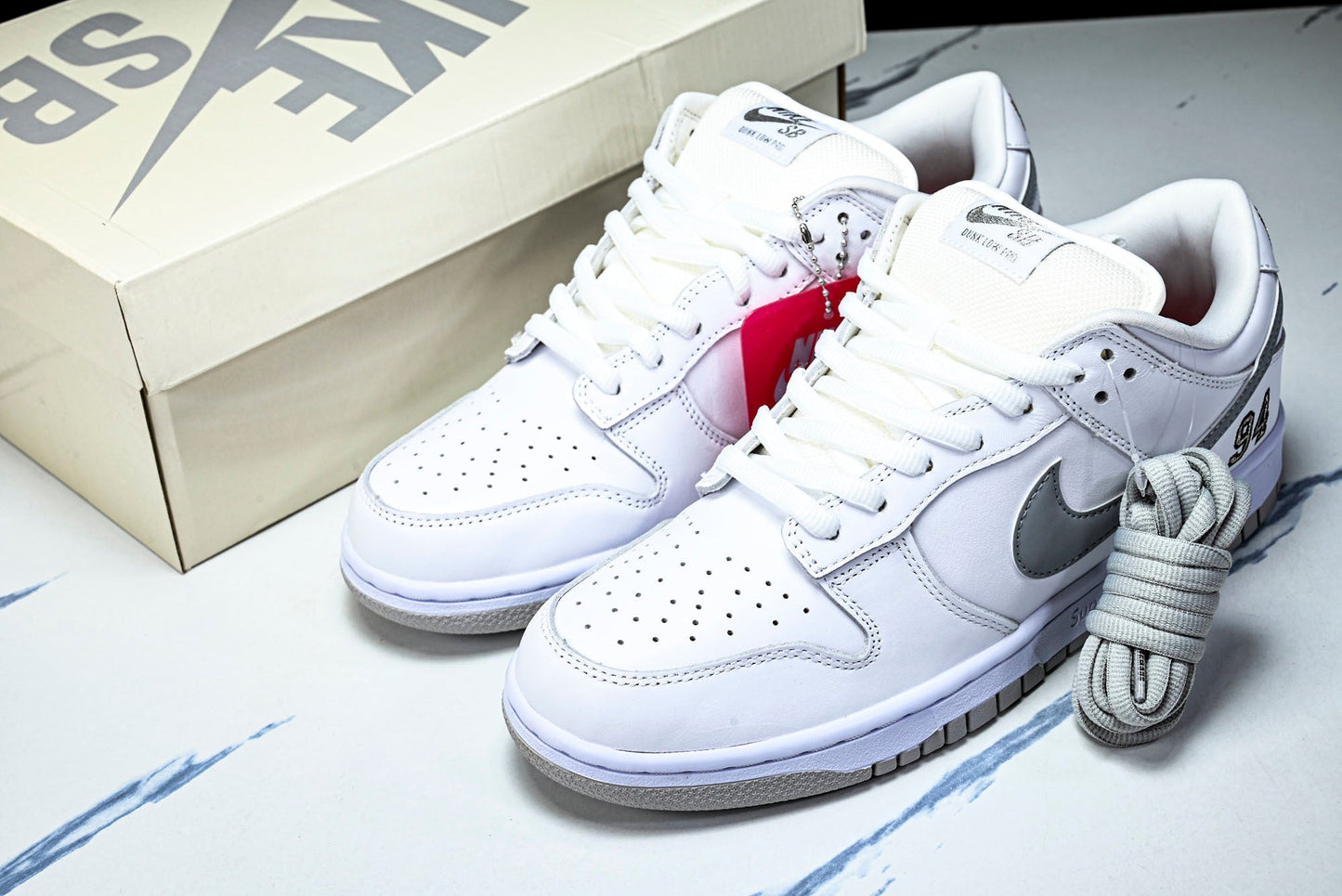 SB Dnk Low x Supreme 94 White Metallic Silver